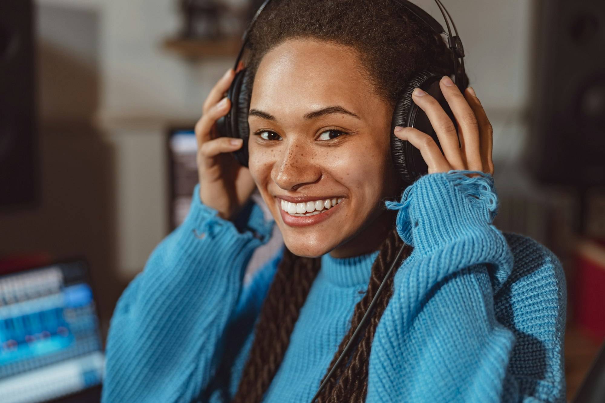 Radio concept - close-up of African American woman speaking on the radio, working as a presenter